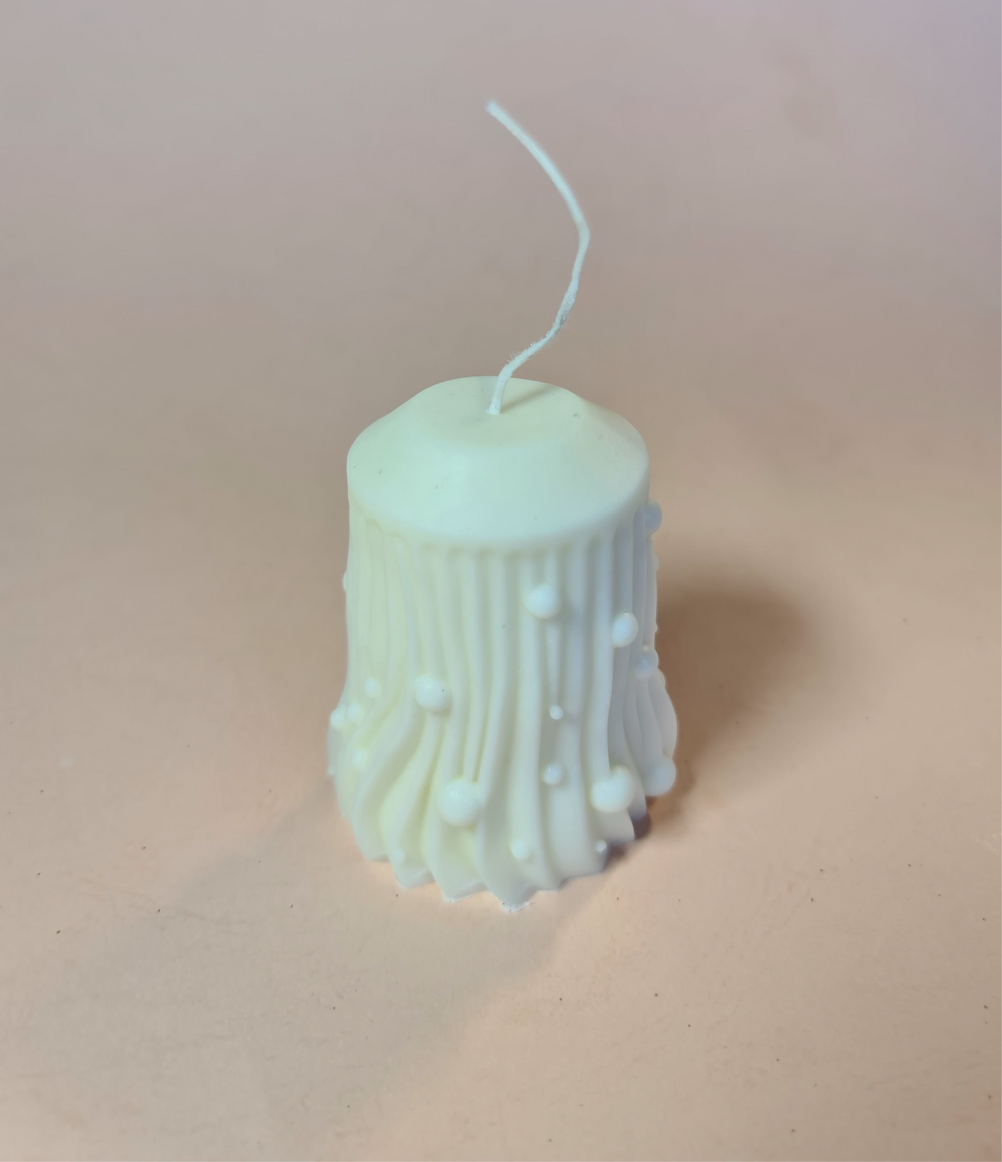 Ball drop pillar candle